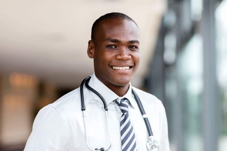 Young male doctor smiling