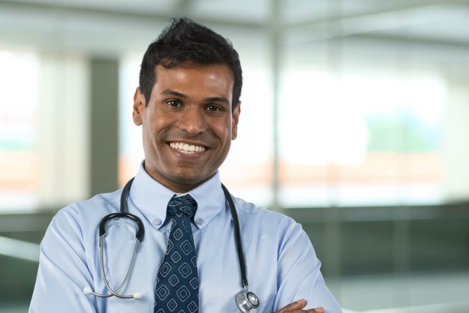 Smart male doctor smiling