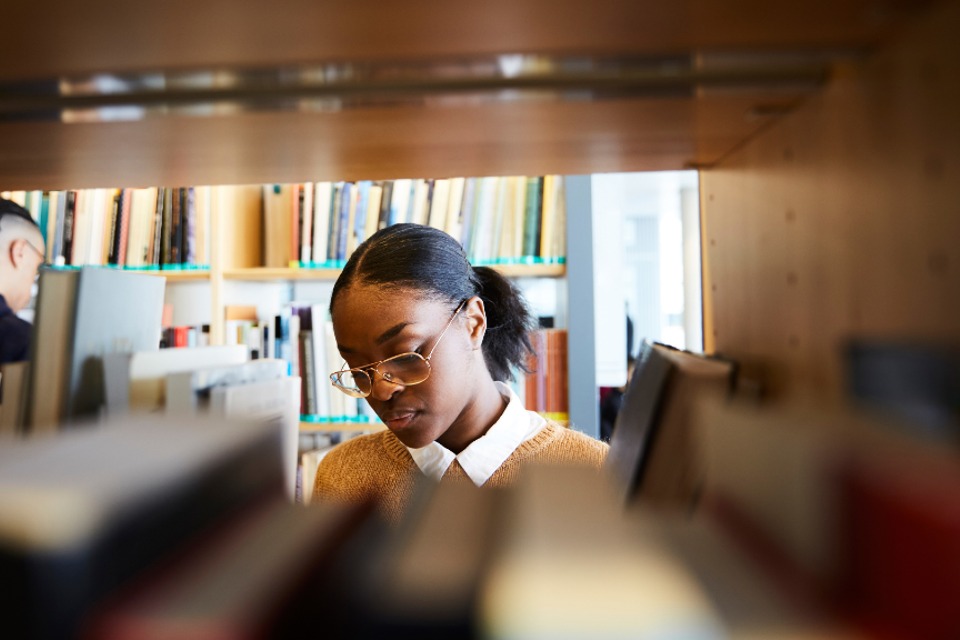 Female student browsing in library
