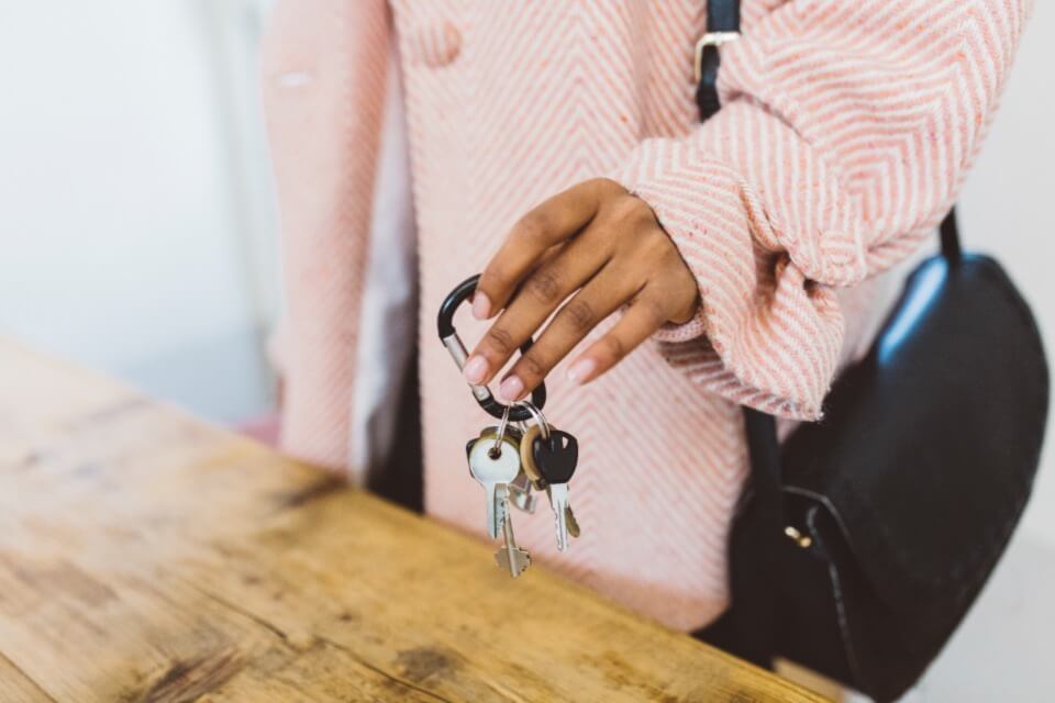 Close up of woman holding set of keys