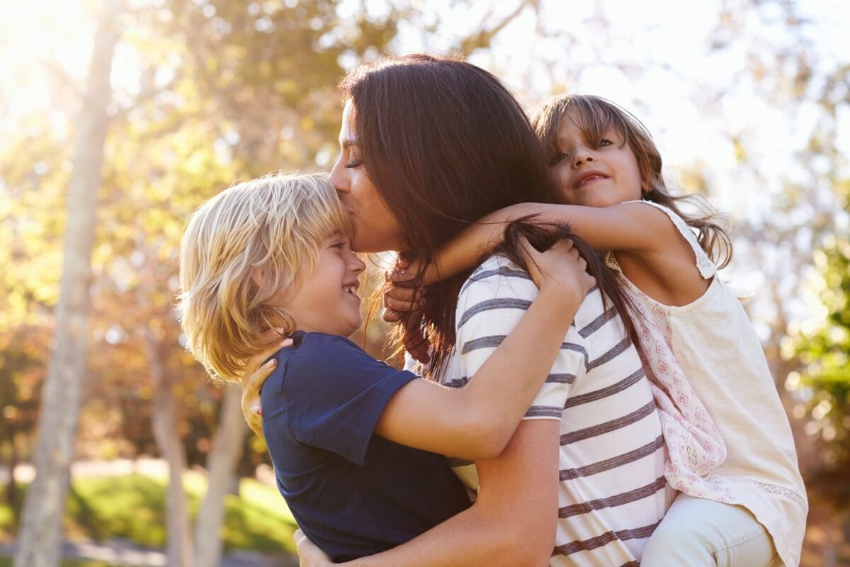 billboard-mother-playfully-holding-son-and-daughter