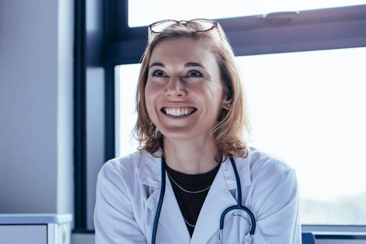 Female doctor smiling in distance Female doctor smiling in distance