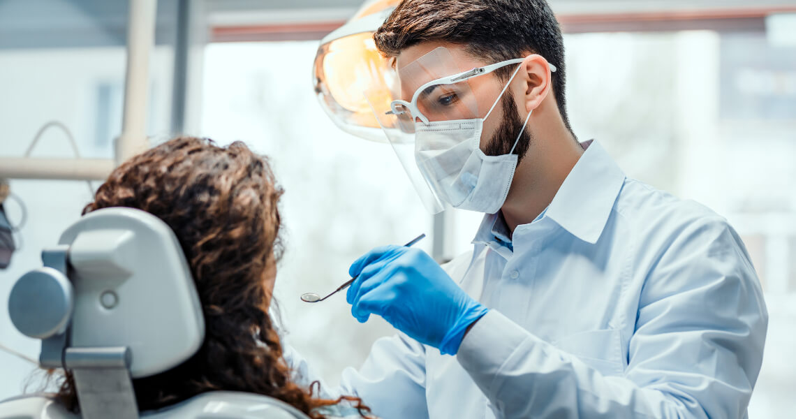 Male dentist with patient Male dentist with patient