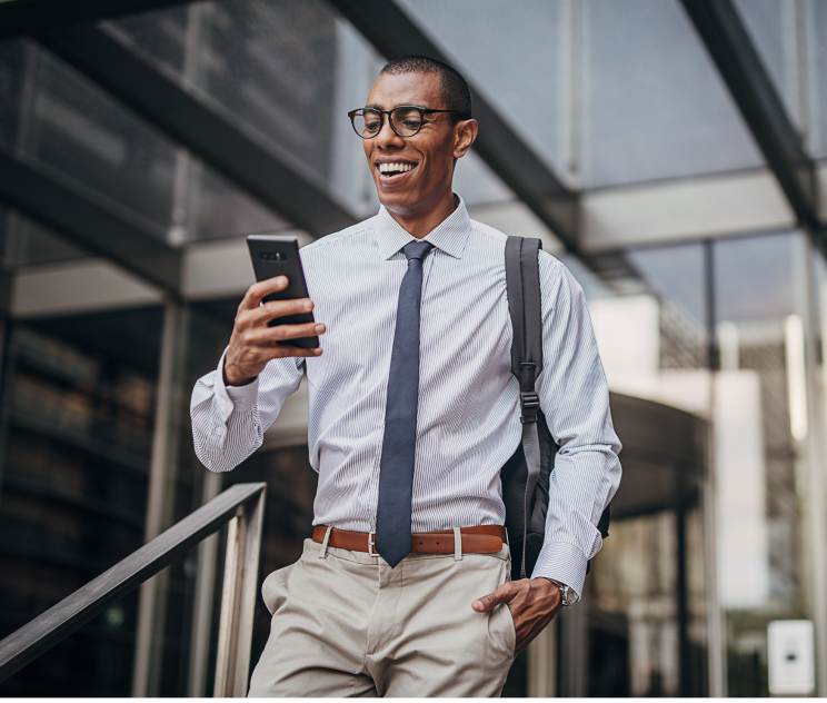 Male professional looking at his phone Male professional looking at his phone