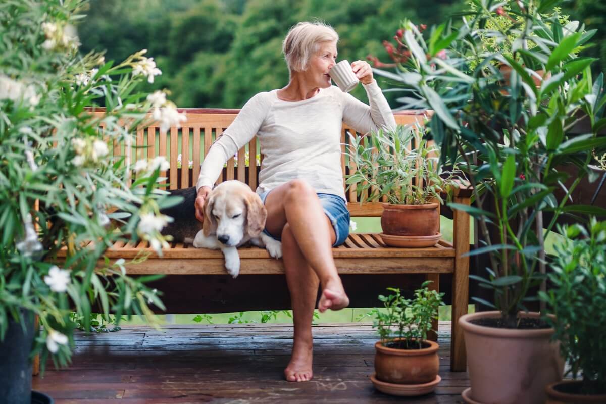 Mature woman relaxing in garden Mature woman relaxing in garden