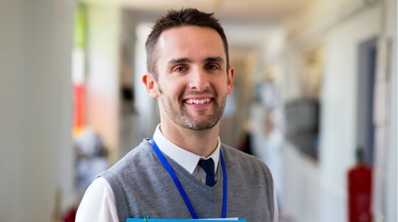 Teacher carrying coursework Teacher carrying coursework