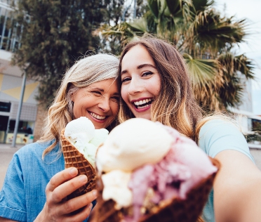 Mother and daughter eating ice cream