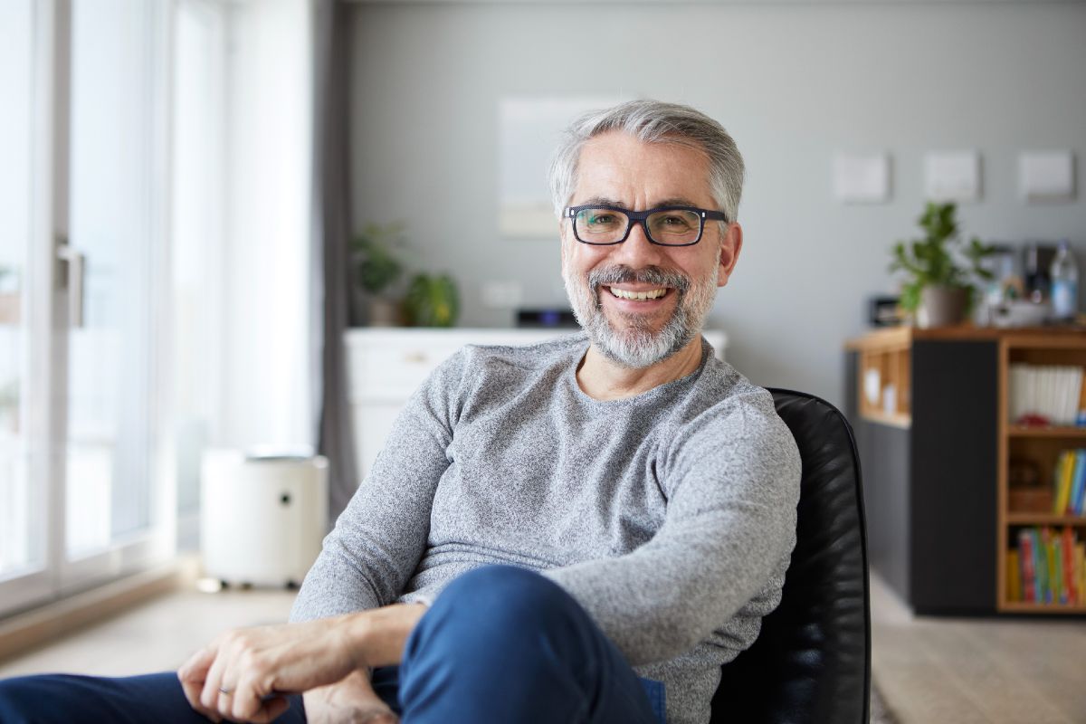 Professional man in home office sitting casually Professional man in home office sitting casually