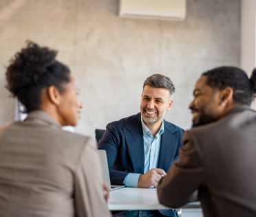 Professional man sitting with woman in office Professional man sitting with woman in office