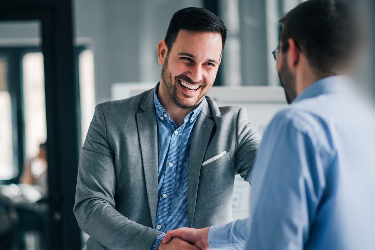 Smart casual man shaking hand Smart casual man shaking hand