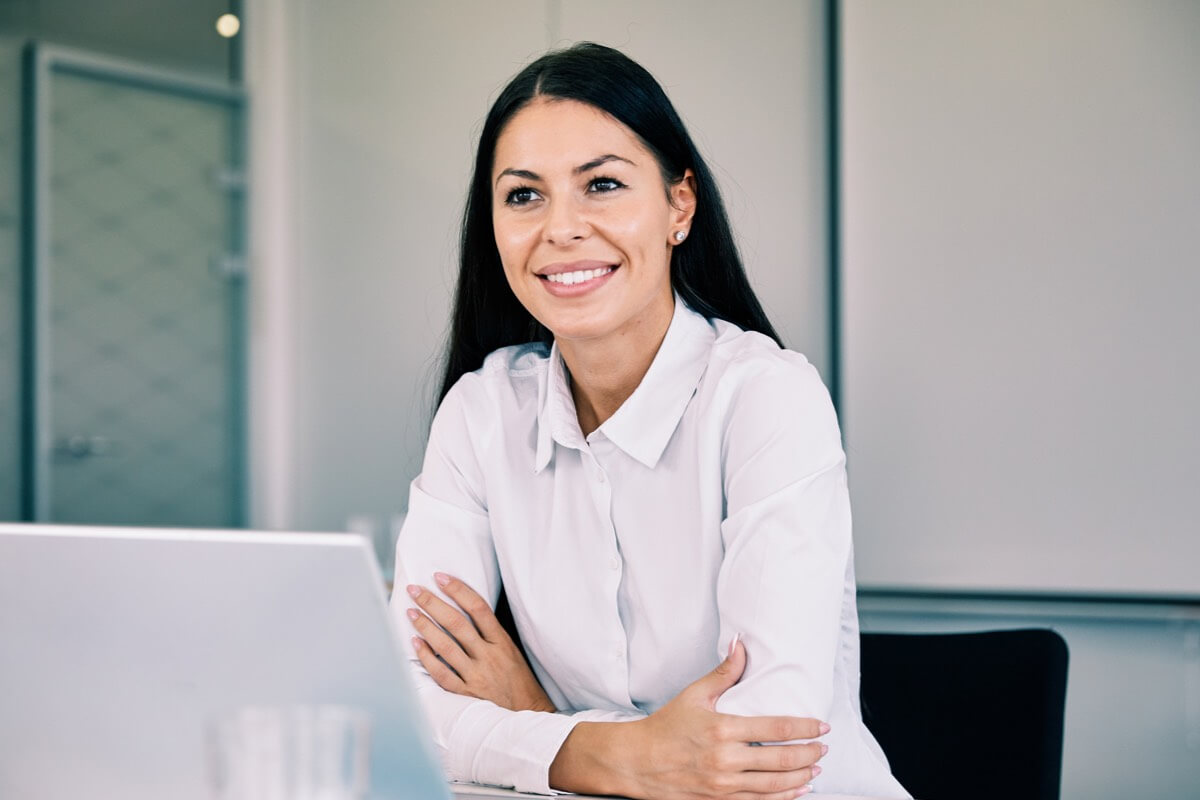 Smart woman smiling at desk Smart woman smiling at desk