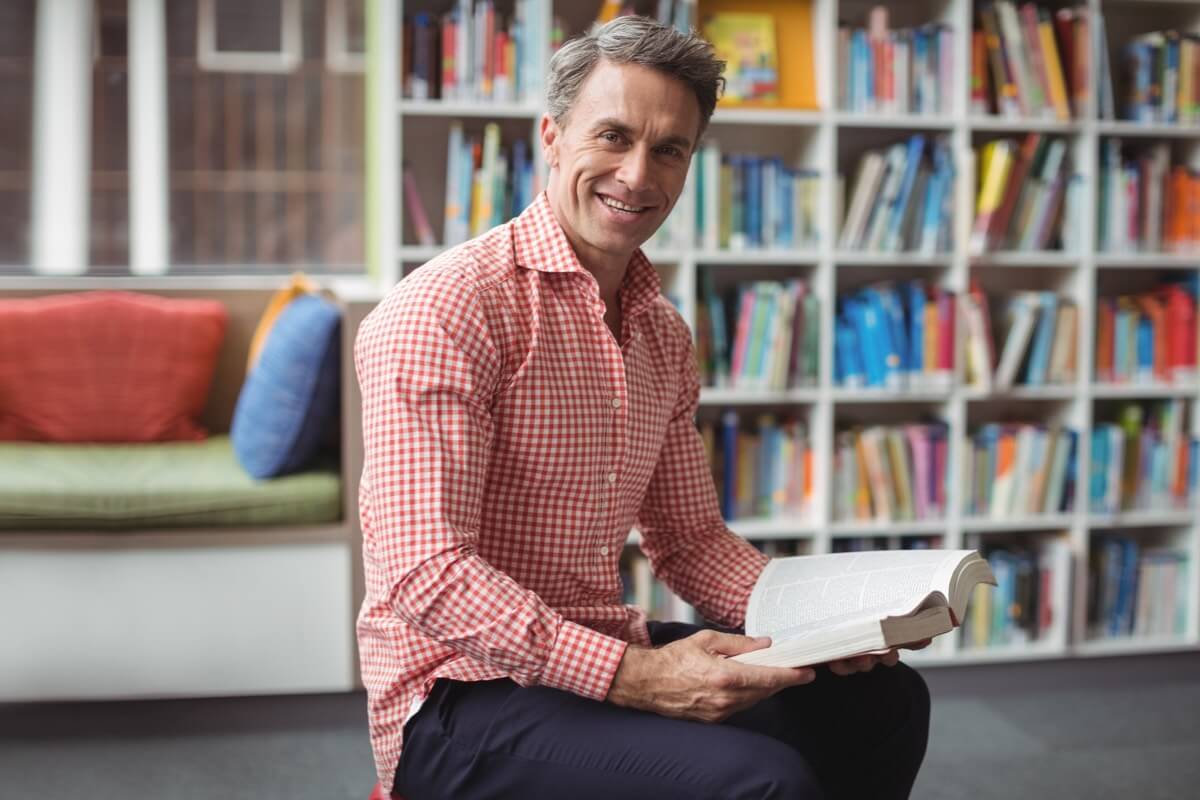Male teacher in library Male teacher in library