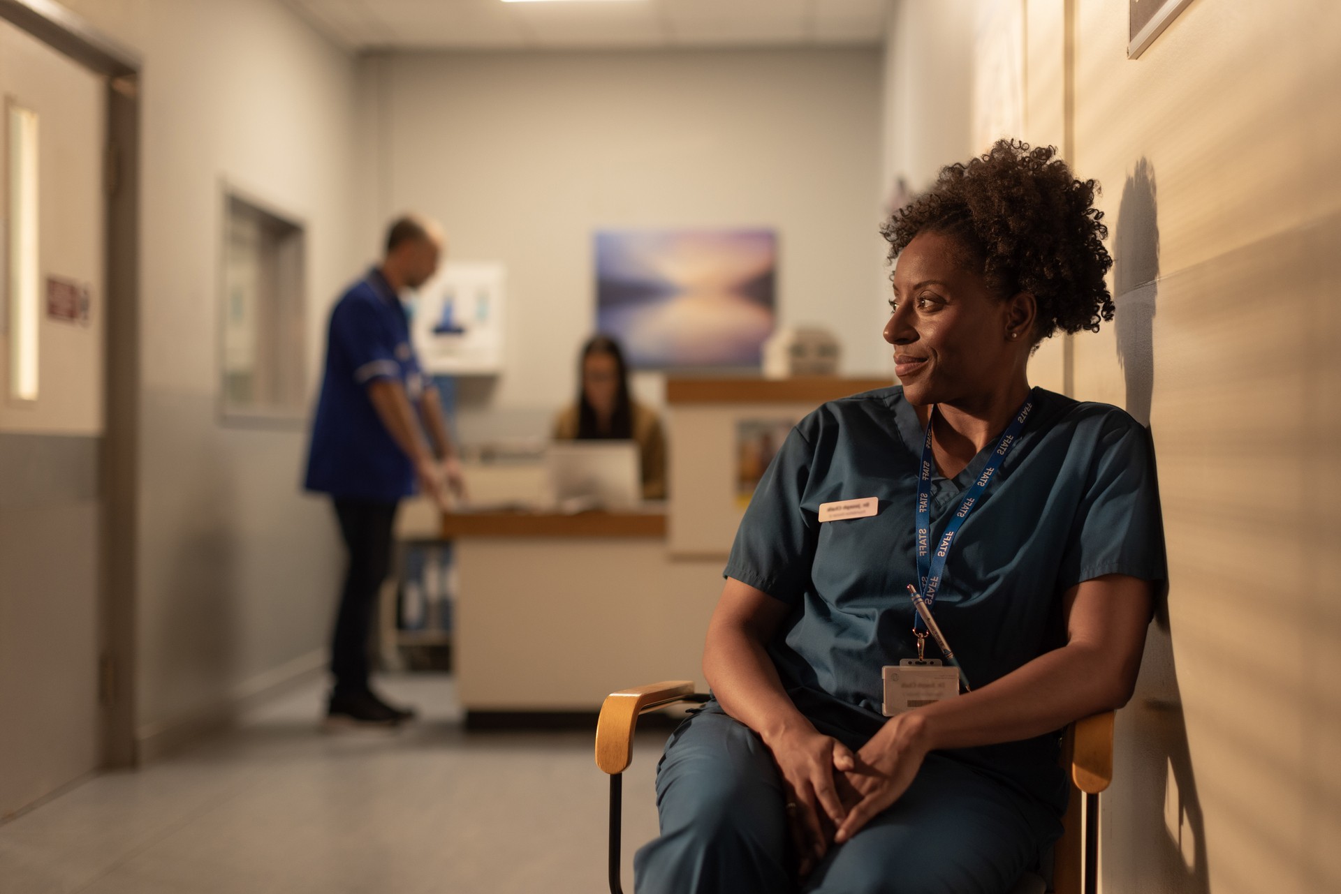 Doctor in a chair looking off to the left