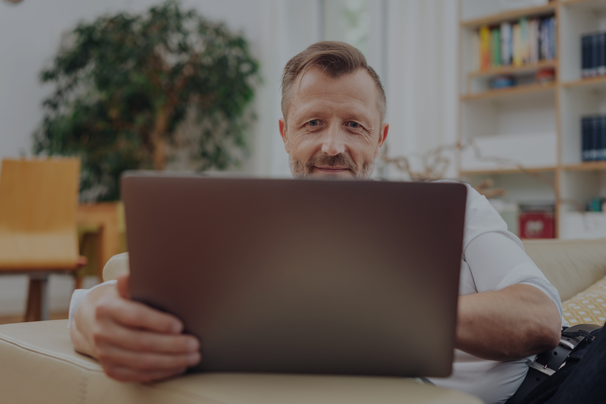 Retirement Club webinars billboard image Mature man looking at laptop