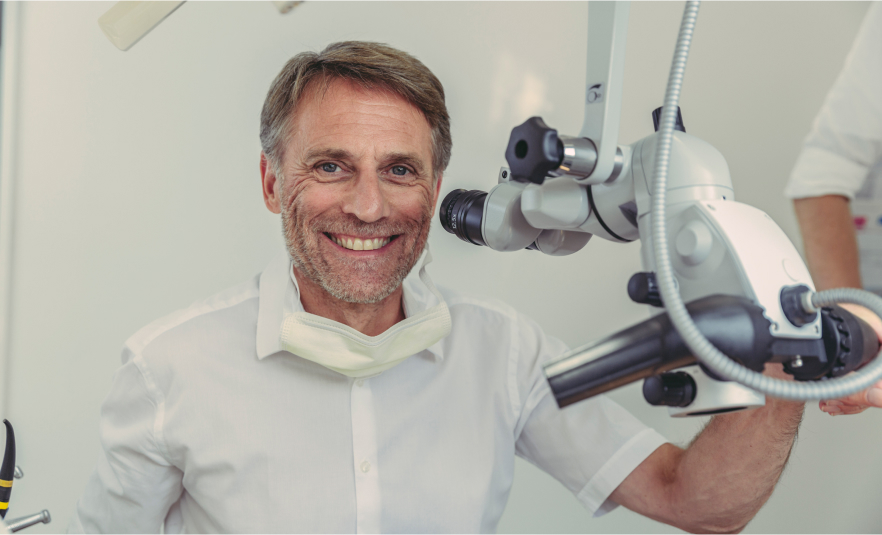 Male dentist smiling