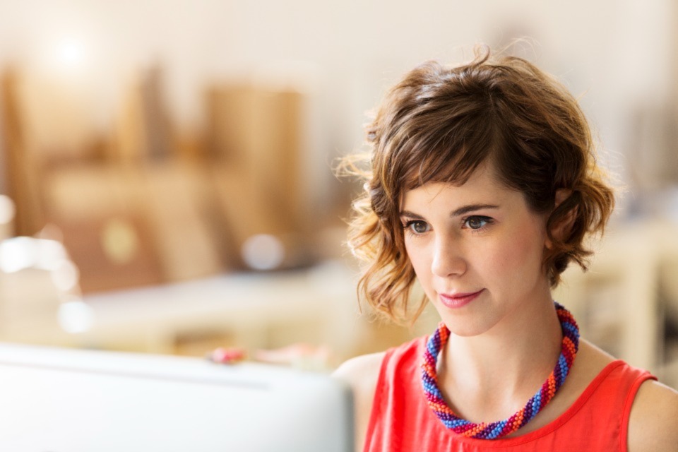 Female professional looking at computer screen
