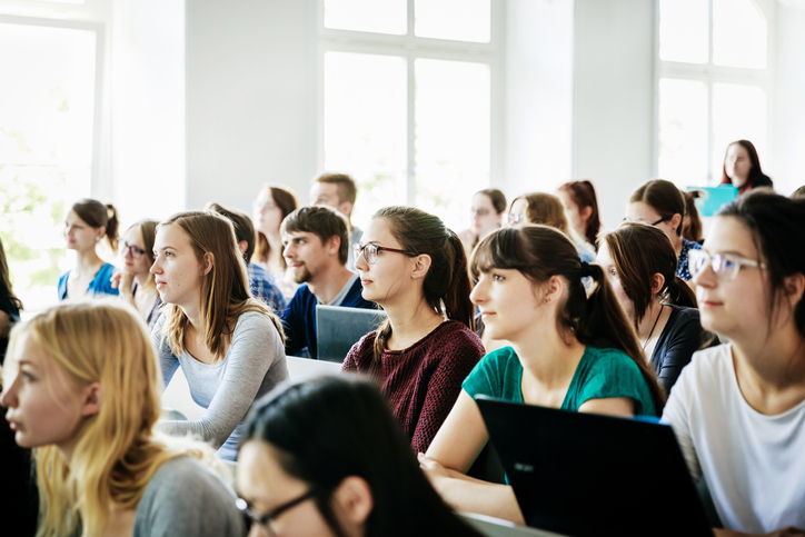 split-column-badge-students-in-lecture
