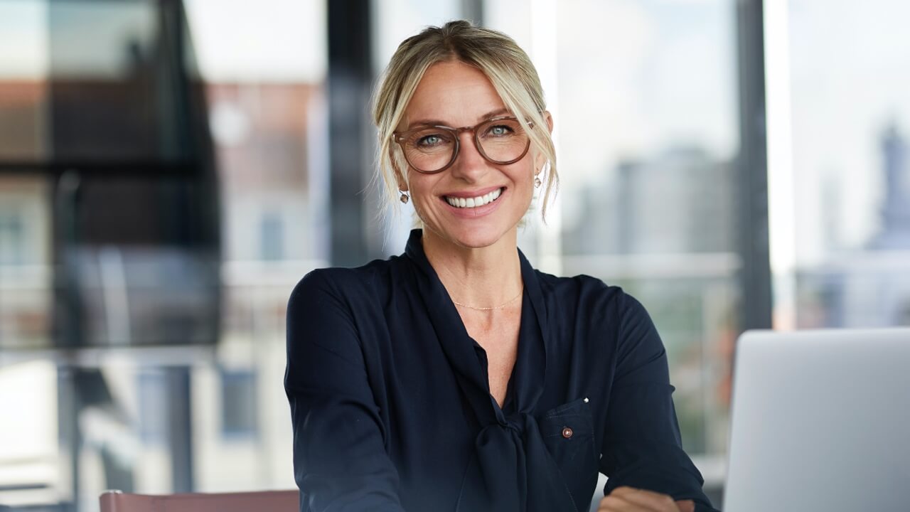 Young female professional wearing glasses smiling