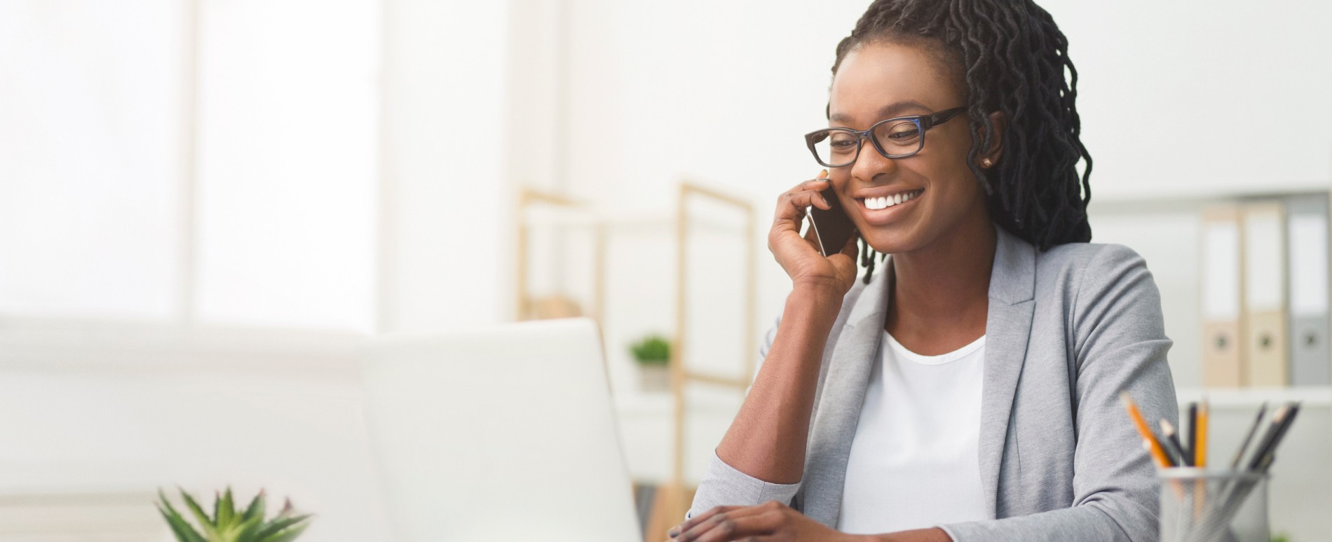Female professional on the phone smiling
