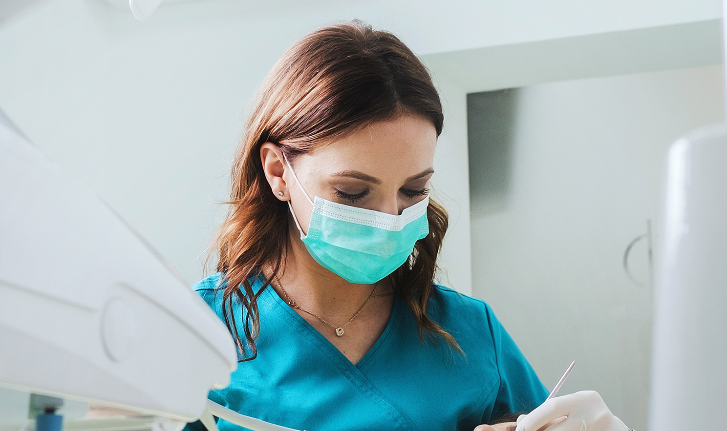 Female nurse looking at diagnostic