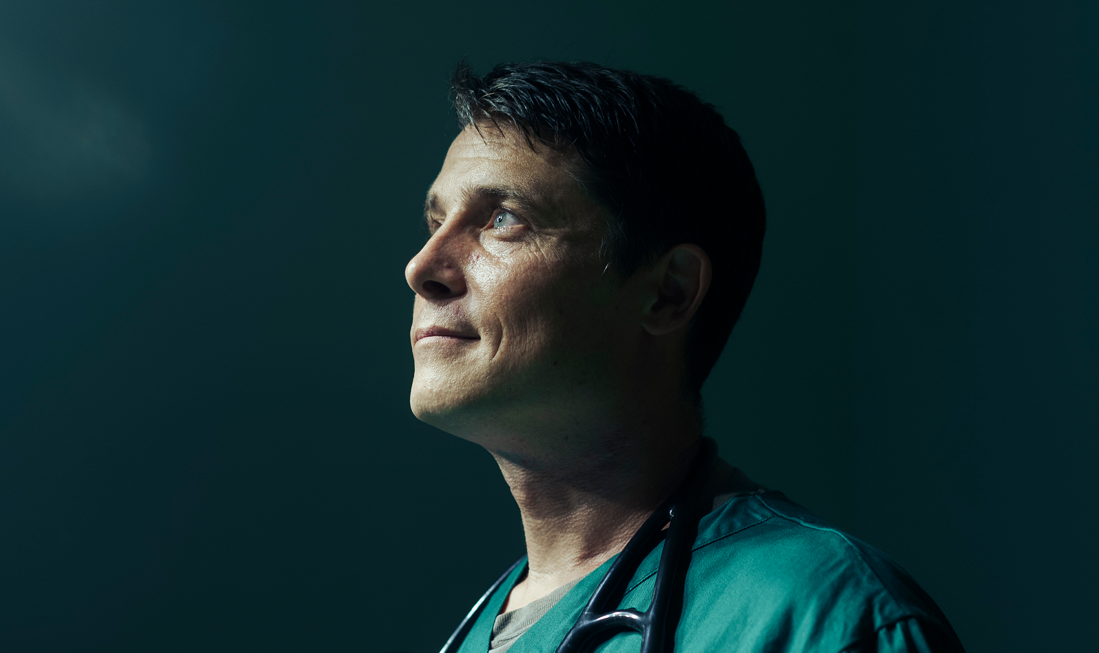 Male doctor staring to the left