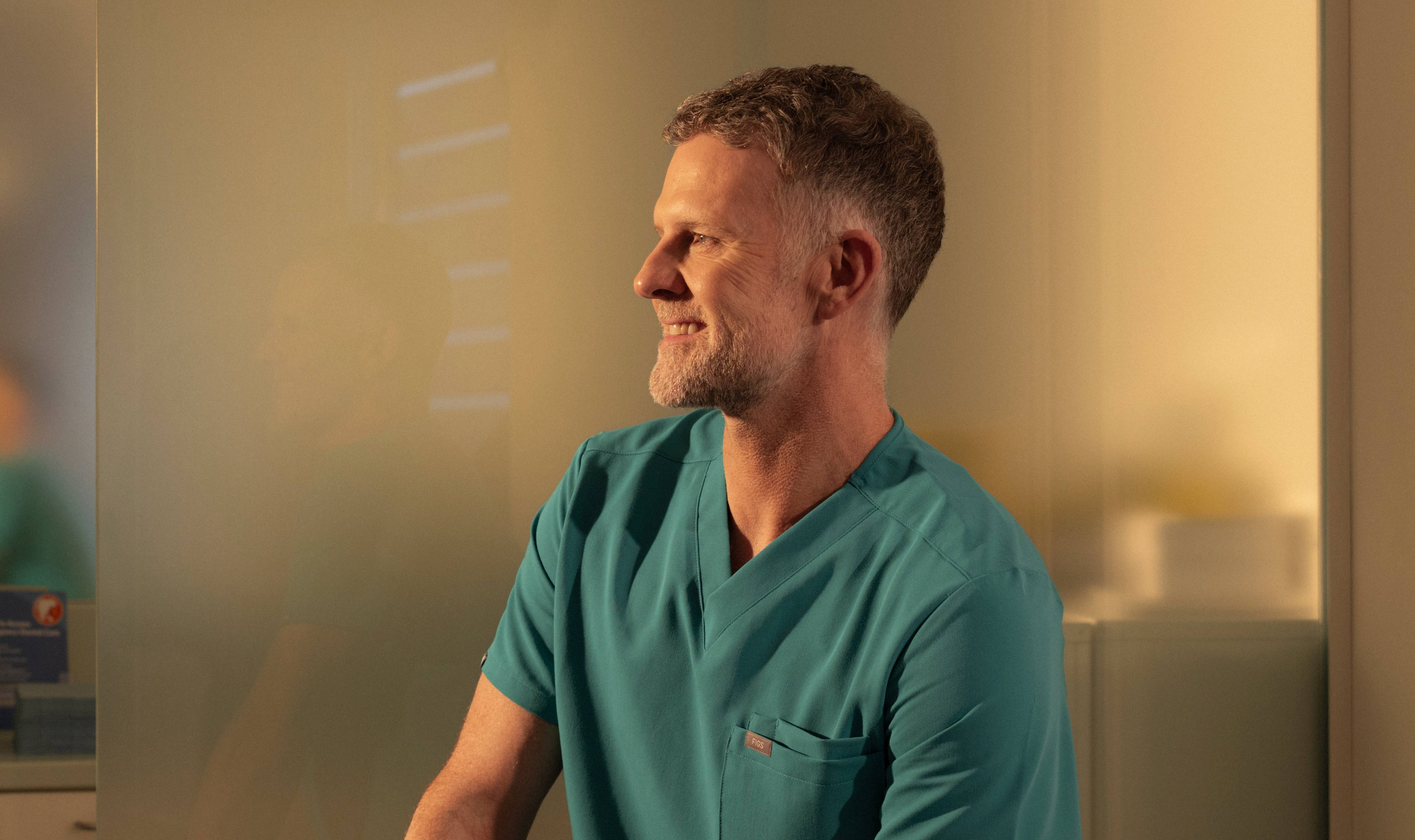 Male dentist smiling
