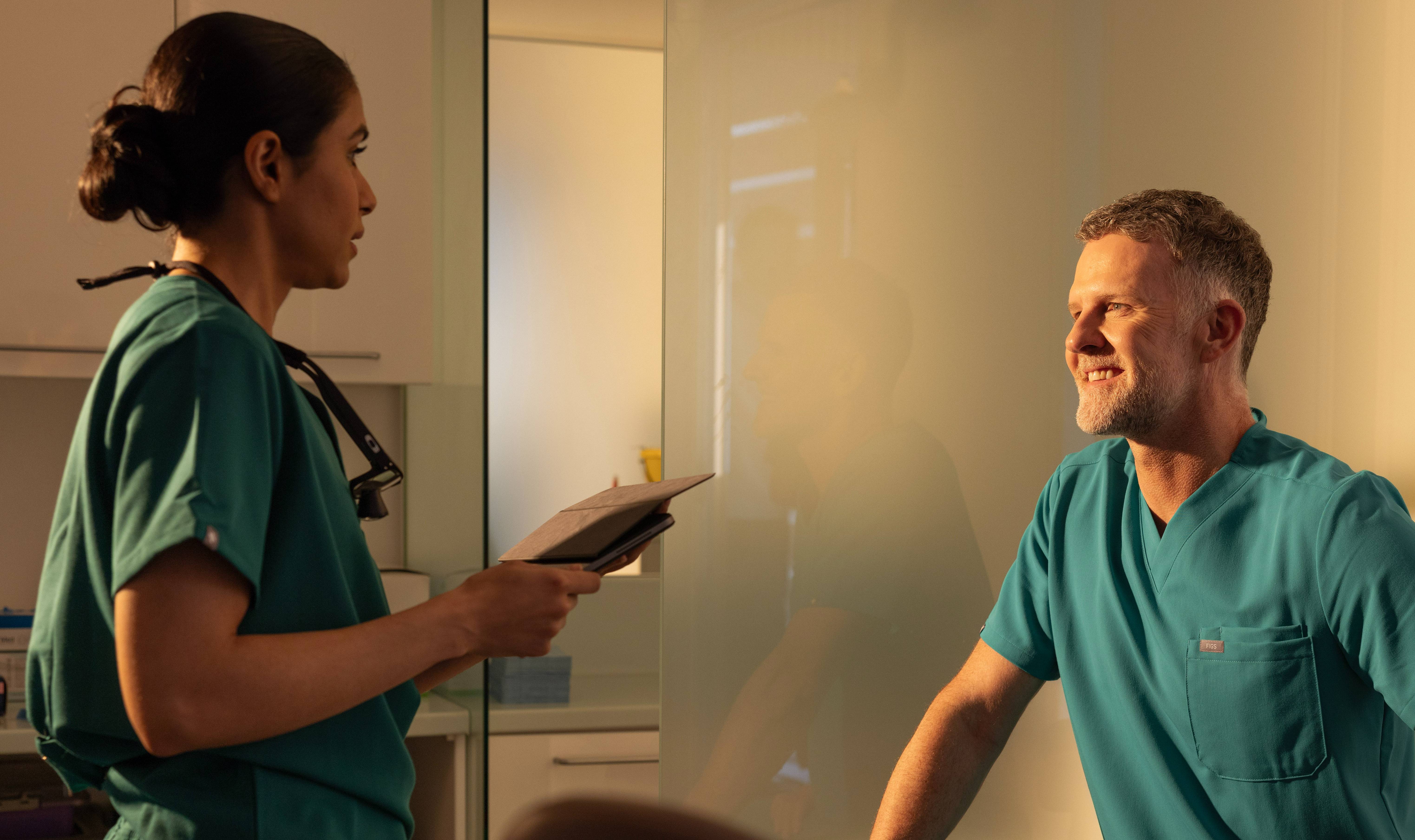 Male and female dentists talking