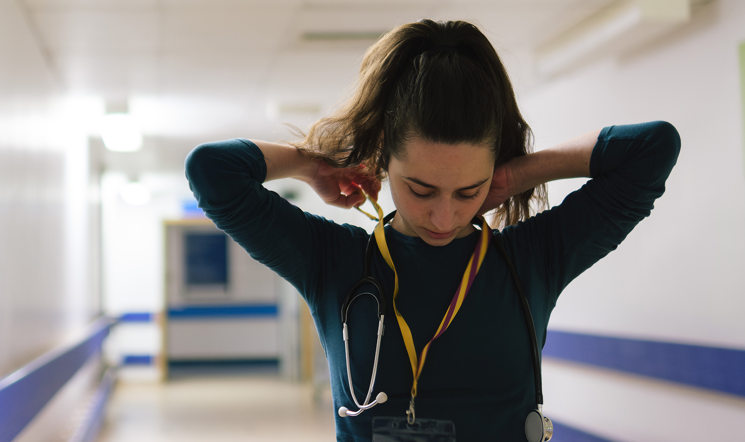Female medic adjusting lanyard