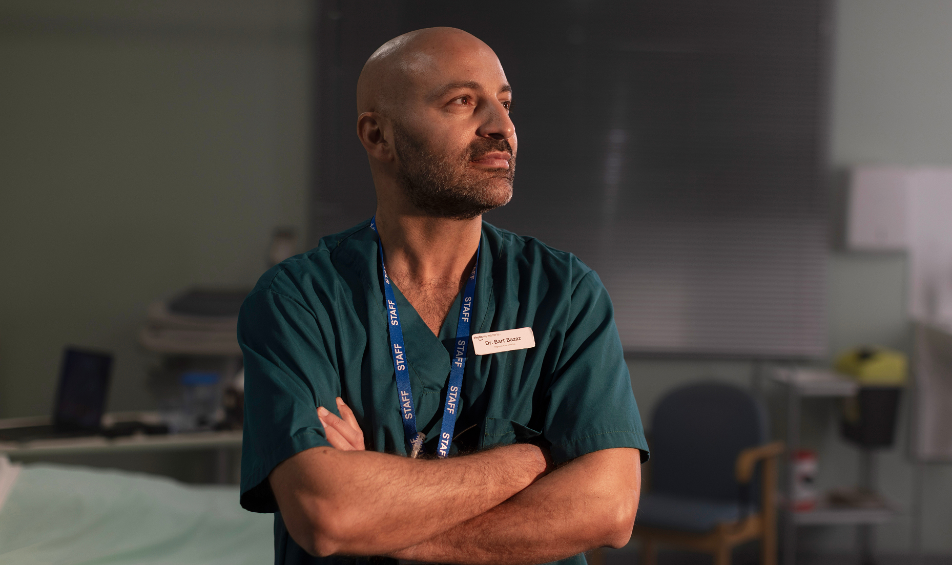 Male doctor with arms crossed