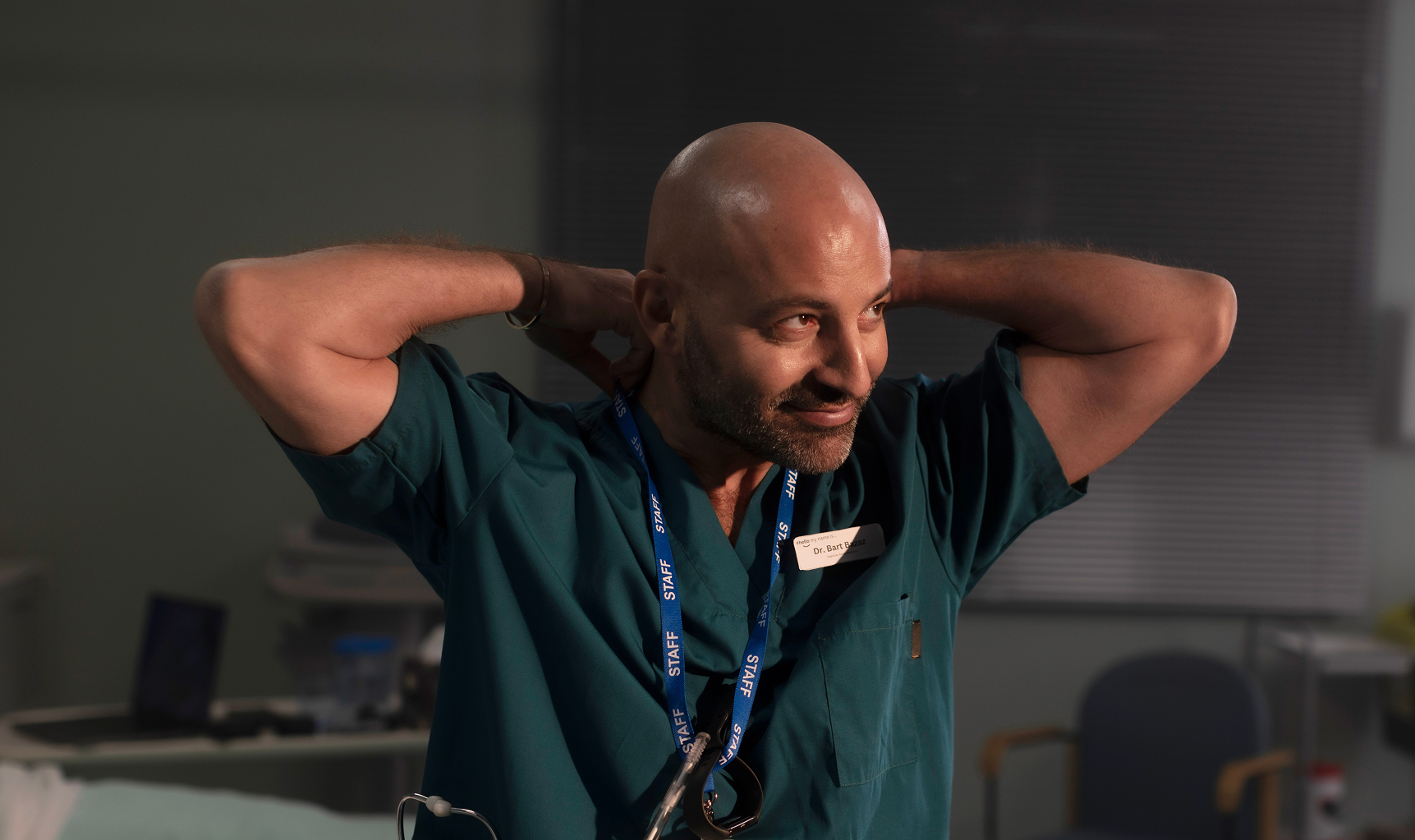 Male doctor adjusting lanyard