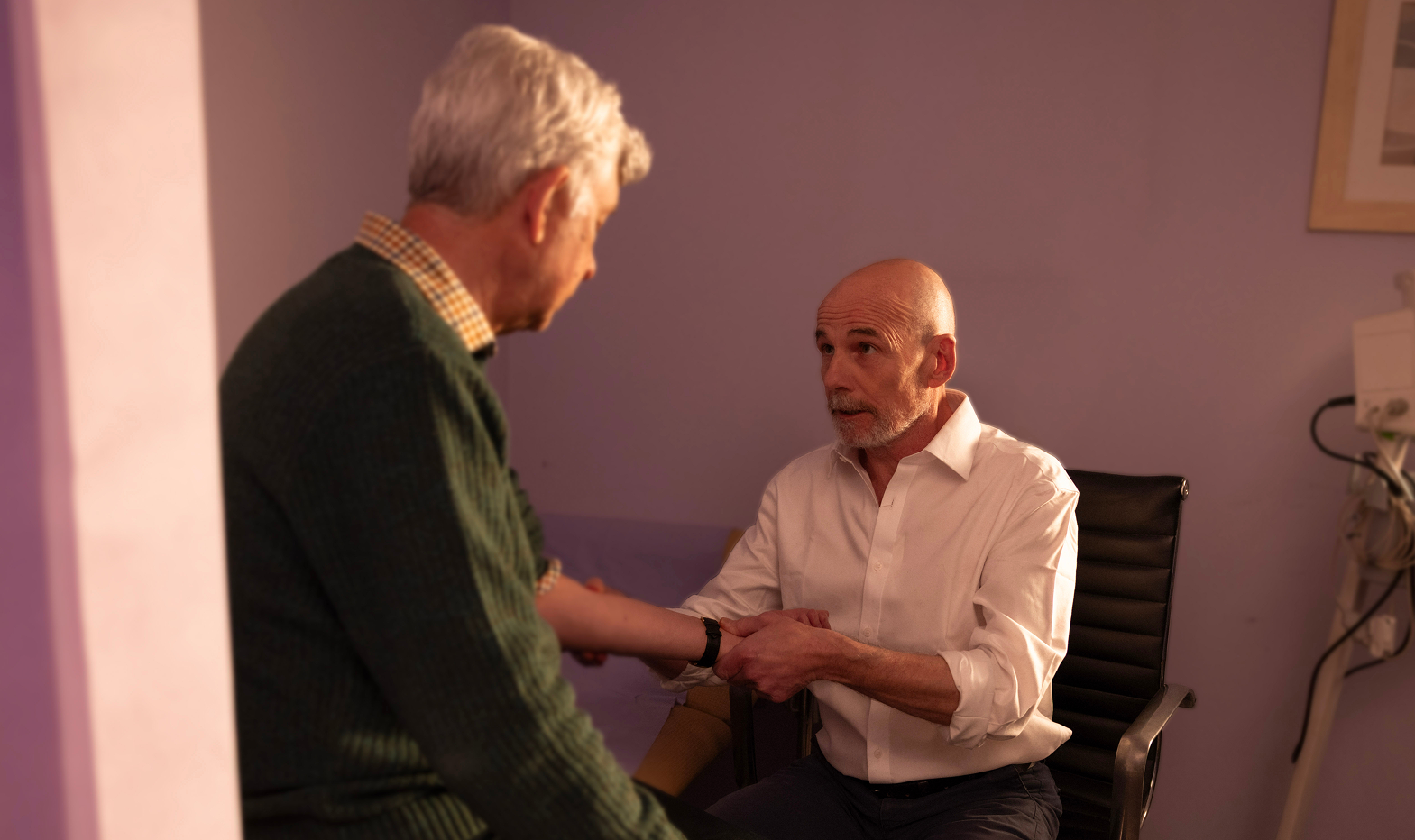 Doctor assessing elderly patient
