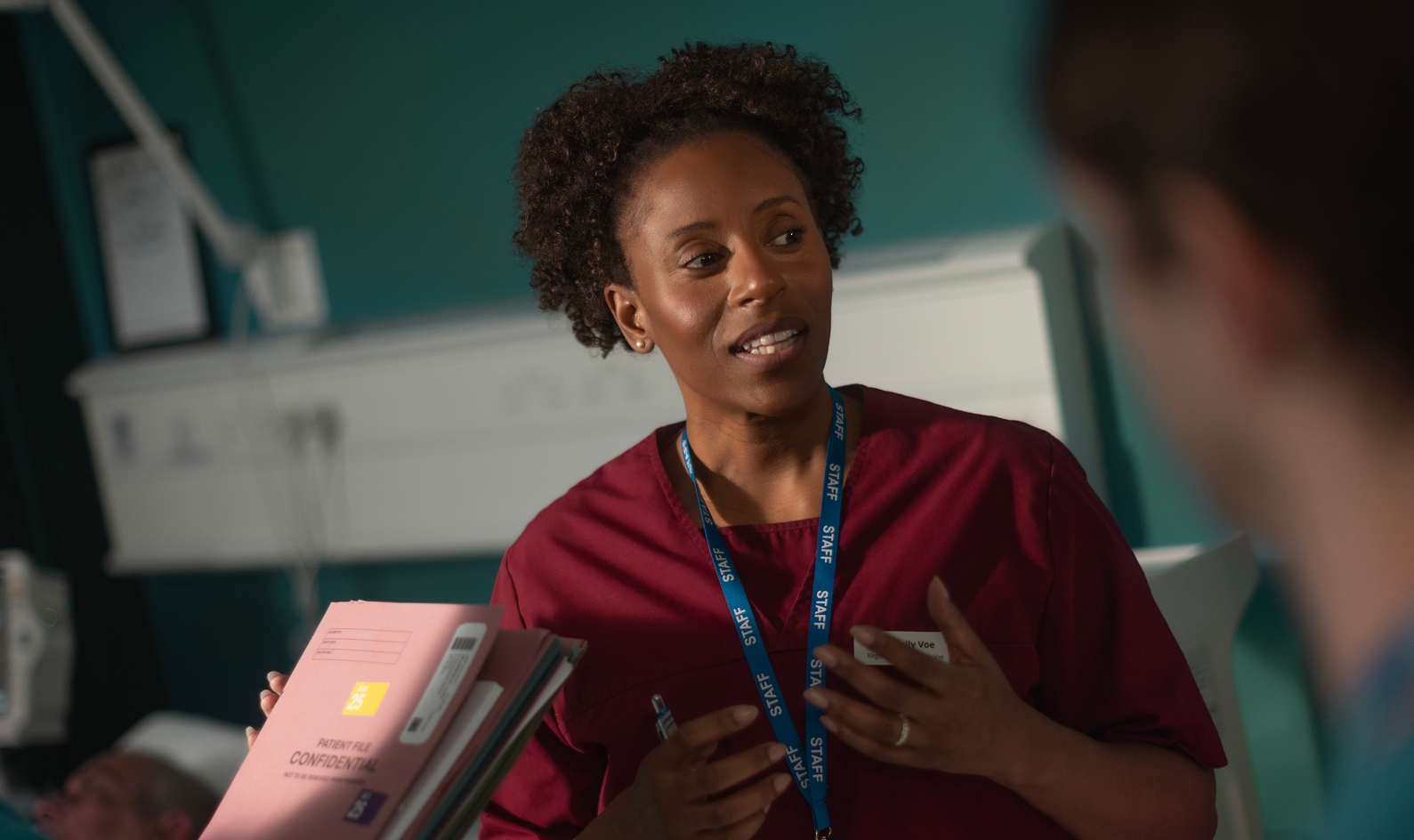 Female doctor talking to team