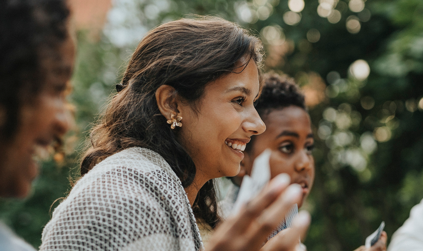 Young woman smiling at gathering