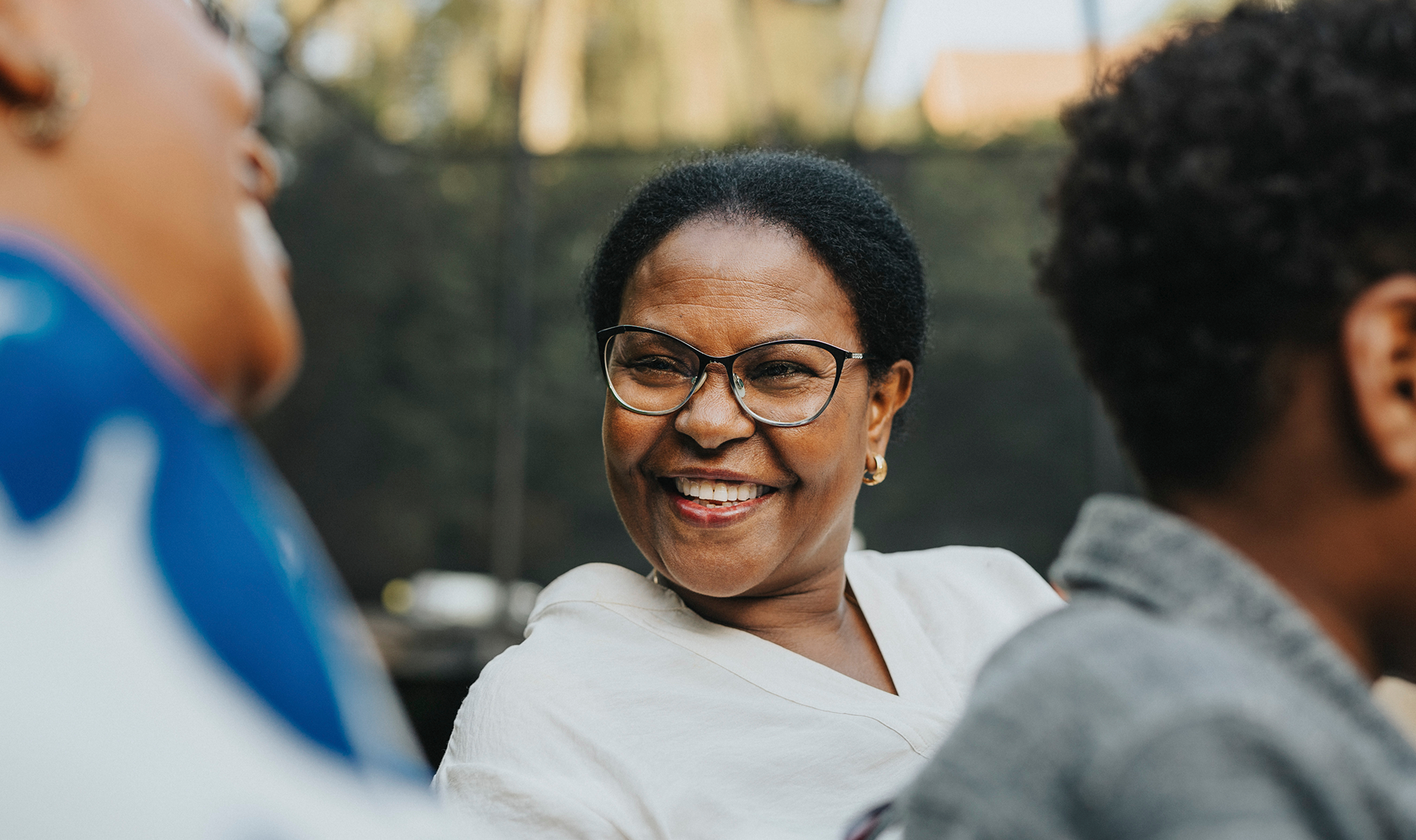 Woman smiling at gathering