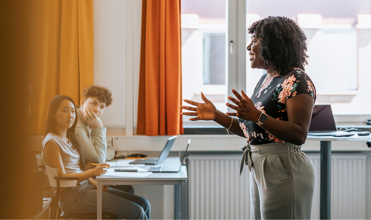 Female teacher teaching class