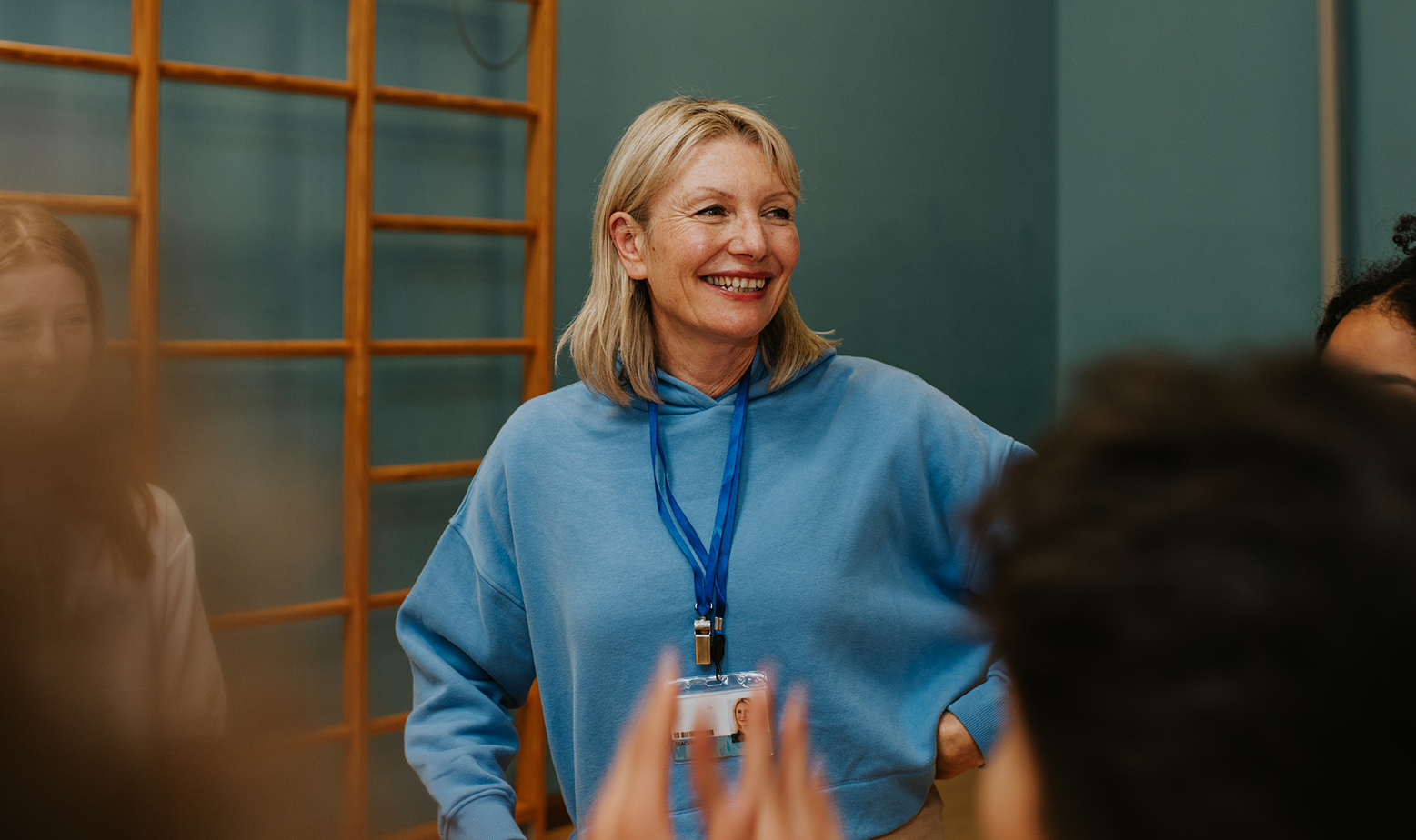 Female PE teacher teaching class