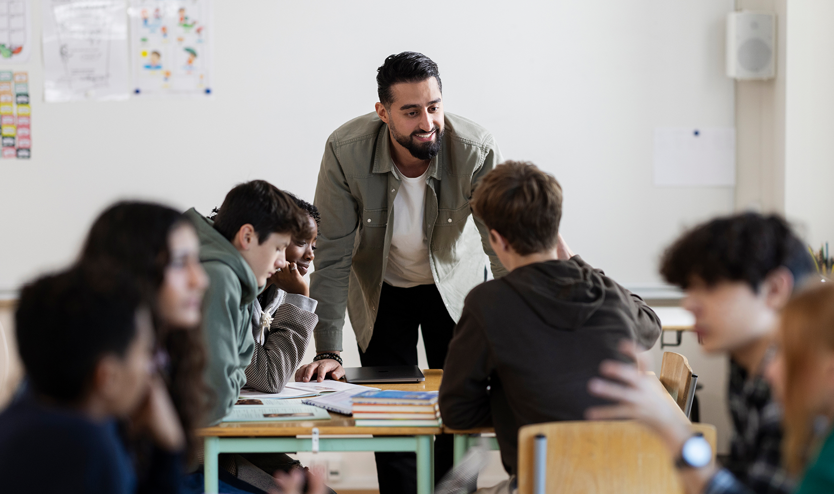 Male teacher engages class