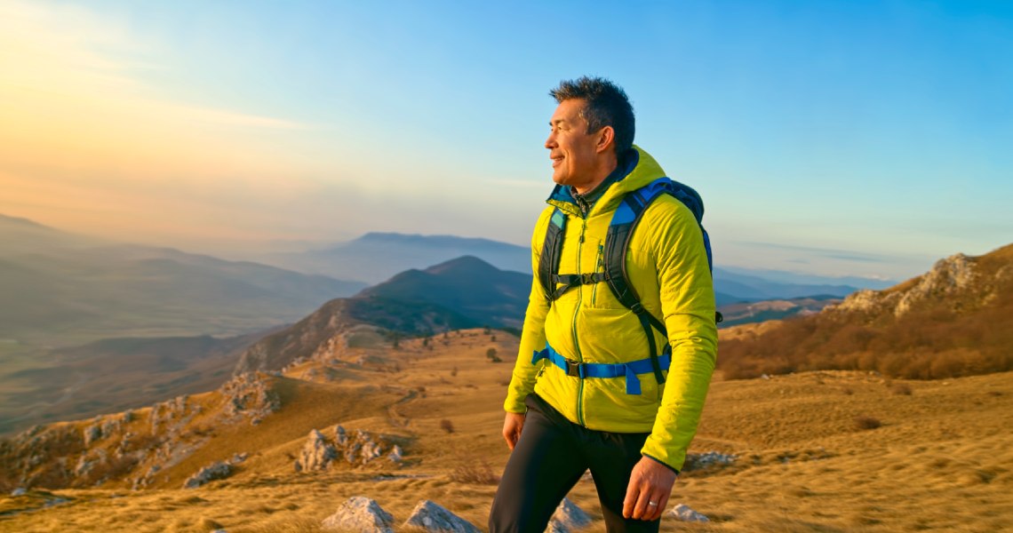 Man hiking during sunset Man hiking during sunset